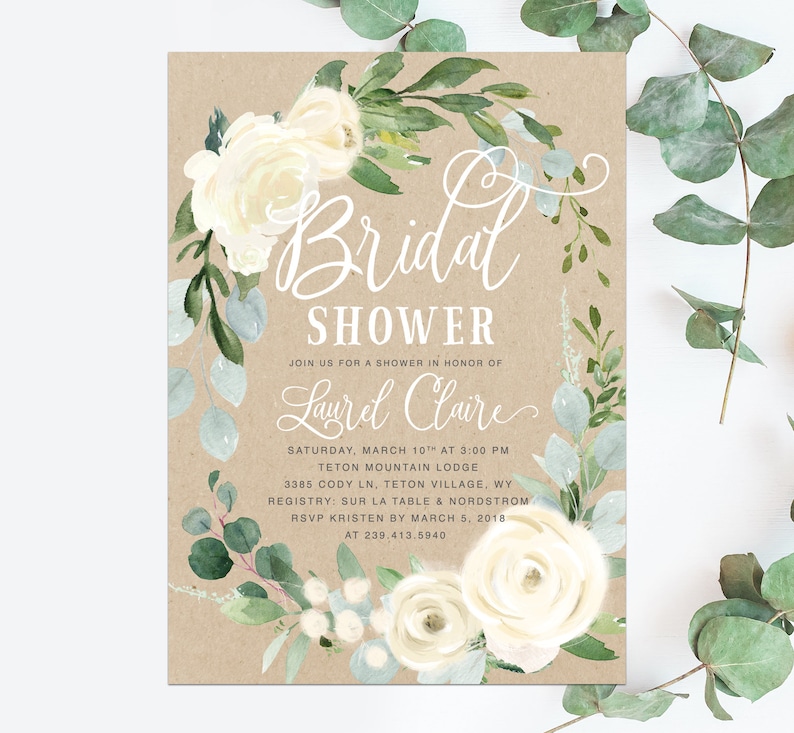 K&ouml;nnte beinhalten: Eine rustikale braune Einladung mit wei&szlig;en floralen Akzenten f&uuml;r eine Brautparty. Die Einladung lautet "Bridal Shower" und enth&auml;lt den Namen "Laurel Claire", das Datum "Samstag, 10. M&auml;rz um 15:00 Uhr", den Ort "Teton Mountain Lodge" und die Adresse "3385 Cody Ln, Teton Village, WY".