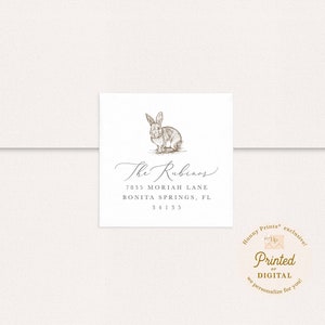 Peut inclure: Une étiquette d'adresse de retour avec une illustration dessinée à la main d'un lapin. Le texte indique "The Rubinos, 7835 Moriah Lane, Bonita Springs, FL 34135".