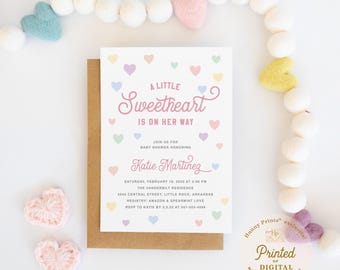 May include: A white rectangular baby shower invitation card featuring pastel-colored hearts and the text A LITTLE SWEETHEART IS ON HER WAY, JOIN US FOR BABY SHOWER HONORING Katie Martinez, with event details including date, time, and location.