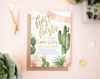 May include: A rectangular invitation card featuring gold script text that reads First Fiesta, Carrie Kate's First Birthday, and event details. The design includes watercolor illustrations of green cacti, succulents, pink flowers, and a decorative banner.