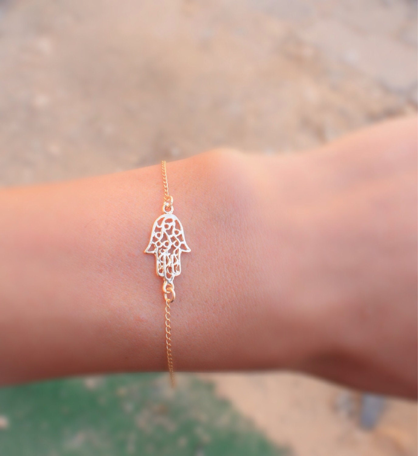 Gold Finish Hamsa Hand Bracelet Design by Flowerchild By Shaheen Abbas at  Pernia's Pop Up Shop 2024