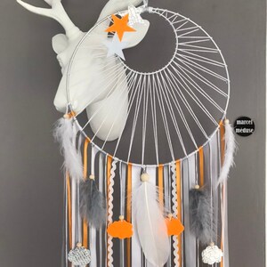 Catches dreamcatcher dreams weaving sun, orange, gray and white with stars and clouds image 2