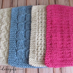 May include: Four knitted dishcloths in different colors and patterns. The dishcloths are beige, blue, beige, and pink.  The dishcloths are made with a textured stitch.