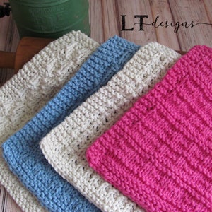 May include: Four knitted dishcloths in different colors and patterns. The dishcloths are stacked on top of each other. The top dishcloth is pink, the next is white, the next is blue, and the bottom dishcloth is white.