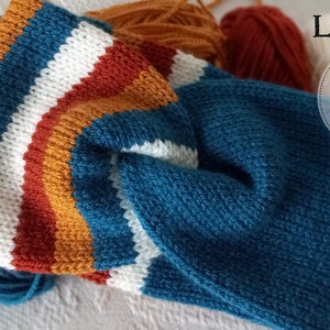 May include: A blue, white, orange, and red striped knitted headband with yarn balls in the background. The text "LT designs Knitting Pattern" is visible in the image.