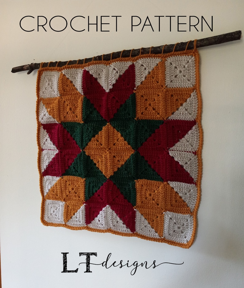 May include: A crochet wall hanging with a starburst pattern in shades of red, green, yellow, and white. The hanging is attached to a branch with twine. The text "LT designs" is visible at the bottom of the image.