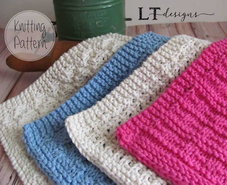 May include: Three knitted dishcloths in different colors: white, blue, and pink. The dishcloths are stacked on top of each other. The image includes the text "Knitting Pattern" and "LT designs".