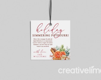 May include: White gift tag with red text that reads "holiday simmering potpourri". The tag includes instructions for making a simmering potpourri with orange slices, cinnamon sticks, and other spices. The tag also includes the text "with love, the williams".