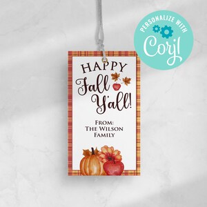 May include: A rectangular gift tag with a plaid border and the text "HAPPY Fall Y'all!". The tag features a pumpkin, apple, and fall leaves illustration. The text "FROM: THE WILSON FAMILY" is also included.