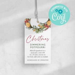 May include: A printable Christmas simmering potpourri recipe tag with a watercolor illustration of a wreath with oranges, cinnamon sticks, and greenery. The text reads "Christmas Simmering Potpourri" and includes instructions for making the potpourri. The tag is personalized with the text "Corjl".