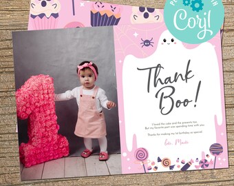 May include: Pink and purple thank you card with a ghost illustration and the text "Thank Boo!"  The card has a photo of a young child holding a pink number one. The text on the card reads "I loved the cake and the presents too. But my favorite part was spending time with you. Thanks for making my 1st birthday so special. Love, Macke."