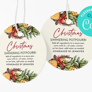 May include: Two round, cream-colored gift tags with a Christmas-themed design. Each tag features a watercolor illustration of cinnamon sticks, oranges, and greenery. The text on the tags reads "Christmas Simmering Potpourri" and includes instructions for making the potpourri. The tags are personalized with the name "Jennifer".