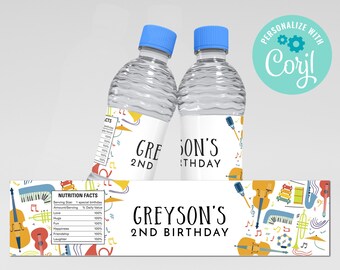 May include: Two clear plastic water bottles with labels for a 2nd birthday party. The labels feature a musical theme with colorful musical instruments and notes. The text on the label reads "Greyson's 2nd Birthday".