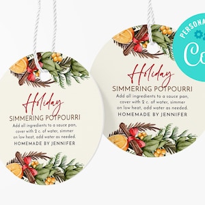 May include: Two round, cream-colored gift tags with a red and white string. The tags feature a watercolor illustration of cinnamon sticks, oranges, and greenery. The text on the tags reads "Holiday Simmering Potpourri" and includes instructions for making the potpourri. The text also says "Homemade by Jennifer".
