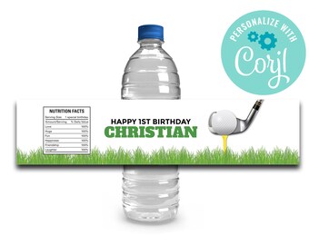 May include: Water bottle label with a green grass border and a golf club hitting a golf ball. The label says "Happy 1st Birthday Christian".