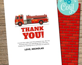May include: Red and white thank you card with a cartoon fire truck and the text "THANK YOU!"  I loved the cake and the presents too. But my favorite part was spending time with you. Thanks for making my 1st birthday so special. LOVE, NICHOLAS"