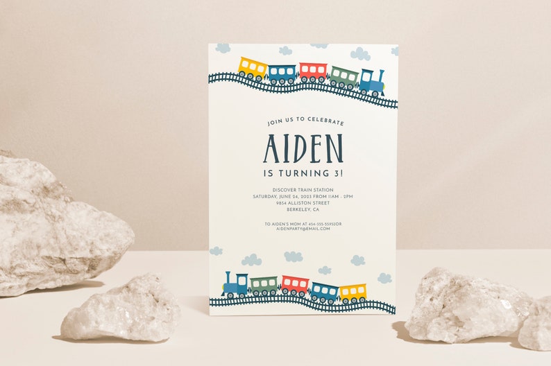 May include: A blue, green, red, and yellow train with white clouds on a light blue background. The text on the invitation reads "Join us to celebrate Aiden is turning 3! Discover Train Station Saturday, June 14, 2023 from 1 AM - 5 PM 8114 Allison Street Berkeley, CA 30 Aiden's Mom at 414-101-519008 AidenParty@email.com"