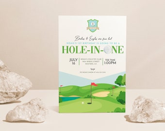 May include: A golf-themed first birthday party invitation with a green golf course, a red flag, and a golf ball. The invitation says "Noah's 1st Birthday is going to be a Hole-in-One" and includes the date, time, and location of the party.