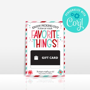 May include: A gift card holder with a festive design. The card features the text "ENJOY PICKING OUT A FEW OF YOUR FAVORITE THINGS!" in red, pink, and teal. A black gift card area is in the center, with the words "GIFT CARD" in white.