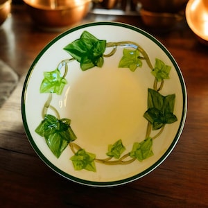 May include: A set of three ceramic mugs with a speckled, matte finish. The mugs are in shades of cream, light gray, and dark gray. Each mug has a simple, minimalist design, perfect for coffee or tea.