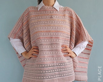 May include: A pink crochet poncho with a striped pattern and tassels. The poncho is made with a delicate open stitch and has a relaxed fit.