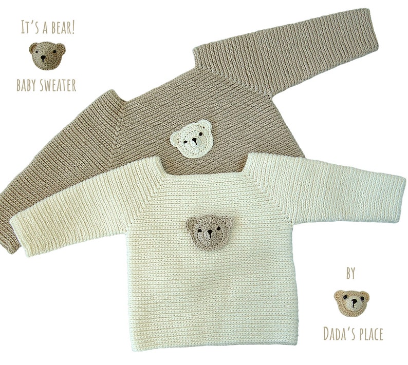 May include: Two knitted baby sweaters with bear appliques. The sweater on top is beige and the sweater on the bottom is white. Both sweaters have a bear applique on the front. The text "It's a bear!" and "Baby Sweater" are above the top sweater. The text "By Dada's Place" is below the bottom sweater.