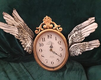 Clock with wings