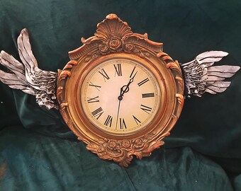 Clock with wings