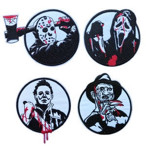 May include: Set of four embroidered iron-on patches featuring horror movie characters. The patches are circular and feature black and white images of Jason Voorhees, Ghostface, Michael Myers, and Freddy Krueger. Each patch has red accents for blood.
