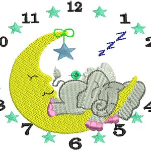 May include: A yellow crescent moon with a sleeping gray elephant on top. The moon has a smiling face and is holding a blue star on a green string. The numbers 1 through 12 are arranged in a circle around the moon and elephant, with green stars between each number.