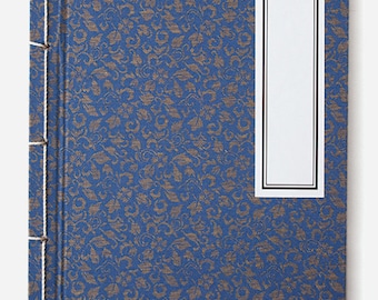 A traditional Korean notebook made of silk, using the technique of tying thread through five holes - blue