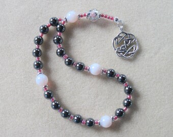 Meditation Beads – Hematite, Pink Milk Glass, Faceted Lampwork focal, and Silver plated Celtic Knot Pendant