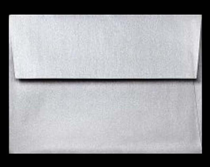 May include: A silver envelope with a flap.