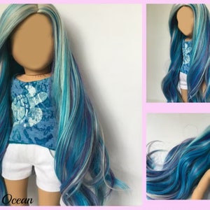 May include: A long, wavy doll wig with blue, teal, white, and purple streaks. The wig is styled in a side part and has a natural, flowing look.