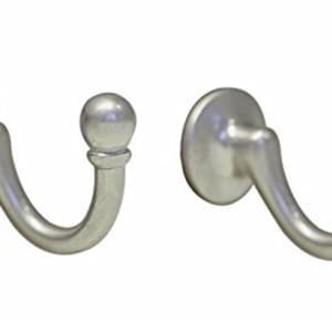 May include: Two silver curtain hooks with a round knob at the end. The hooks are designed to be mounted to a wall or other surface.