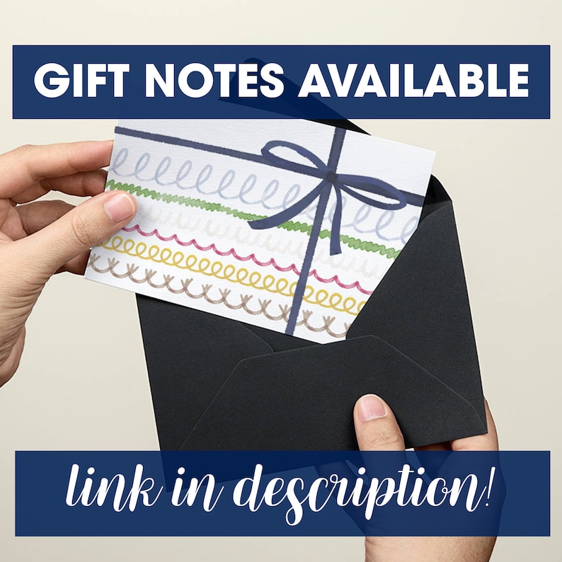 May include: A black envelope with a white card inside. The card has a blue ribbon tied in a bow and colorful lines drawn on it. The text "GIFT NOTES AVAILABLE" is at the top of the image and "link in description!" is at the bottom of the image.