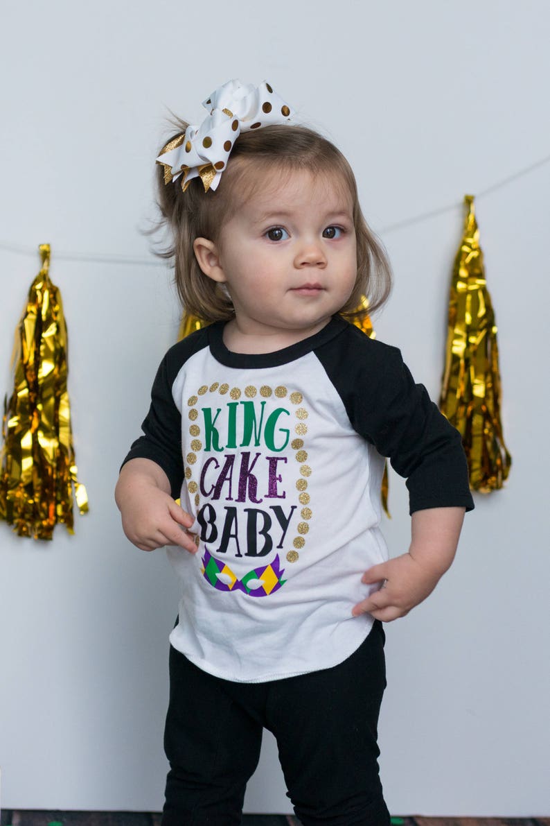 finding baby in mardi gras cake