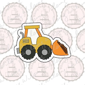 May include: Yellow and orange bulldozer cookie cutter with black wheels and a scoop filled with brown material. The cookie cutter has a white outline and is set against a background with a repeating logo that says "Wilsing Design & Desserts".