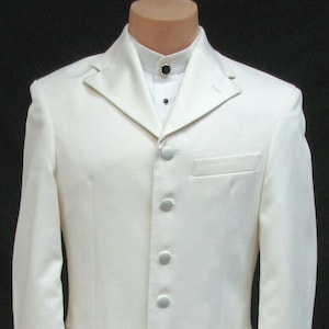 May include: A white long-sleeved jacket with a mandarin collar and a row of silver buttons down the front.