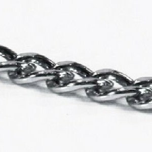 May include: A silver chain necklace with a twisted design.