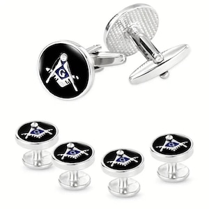 May include: Set of five silver cufflinks with black enamel and a blue and white compass design. The cufflinks feature a square and compass symbol, a common symbol of Freemasonry.