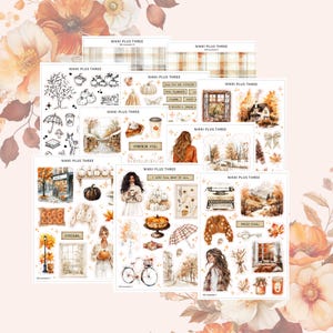 May include: A selection of autumn-themed stickers with pumpkins, leaves, and cosy scenes. The stickers include illustrations of coffee cups, a typewriter, and the text "Hello Fall." The colour palette is warm, with shades of orange, brown, and cream.