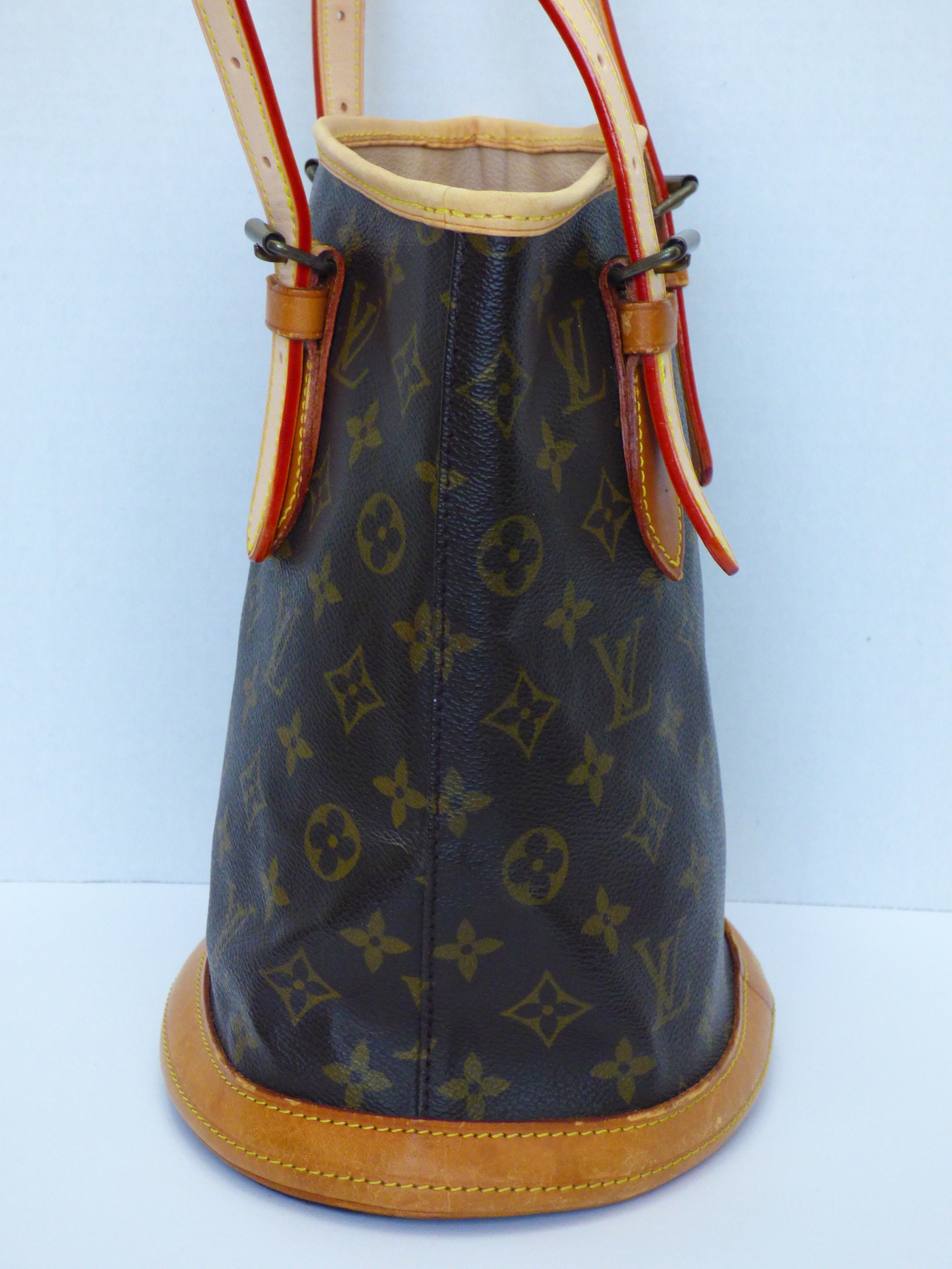 Louis Vuitton Vintage Monogram Petite Bucket Bag, $899, farfetch.com