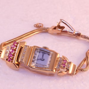 Ladies Watch, Swiss Made Lusina,14k Rose Gold, with rubies, diamonds, Circa 1950's