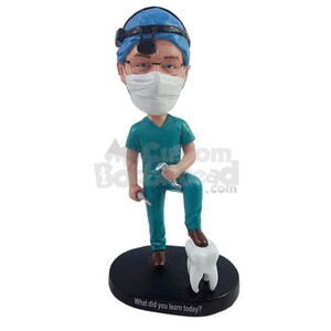 Custom Bobblehead Dentist Stepping on a Big Dental Mold Wearing Scrubs - Personalized Orthodontist Bobblehead and Custom Action Figure