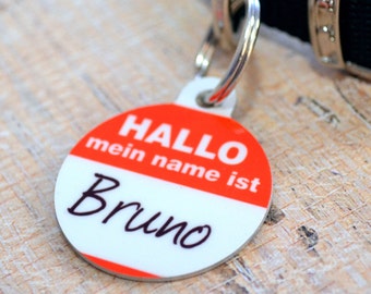 May include: Red and white dog tag with the text "Hallo mein name ist Bruno" in German.
