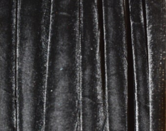 May include: Black velvet fabric with a vertical ribbed texture.