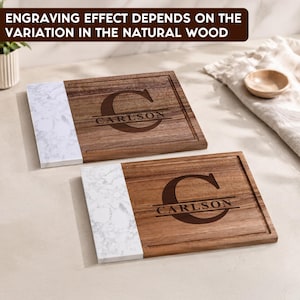 May include: Two rectangular cutting boards featuring a combination of natural brown wood and white marble-patterned sections. Each board is engraved with a large letter C and the name CARLSON. Text reads: ENGRAVING EFFECT DEPENDS ON THE VARIATION IN THE NATURAL WOOD.