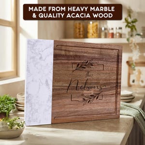 Personalized laser engraved acacia wood and marble cutting board with custom family name. Crafted from premium acacia wood and heavy marble, perfect for charcuterie, weddings, housewarming, anniversary, and Christmas gifts.
