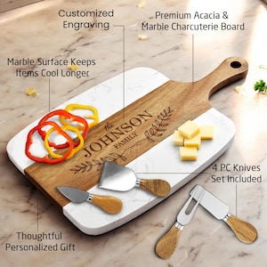 May include: A rectangular charcuterie board made of white marble and brown acacia wood with a handle. The wood section features the engraved text "the JOHNSON FAMILY" with leaf accents. A four-piece knife set with wooden handles is included.
